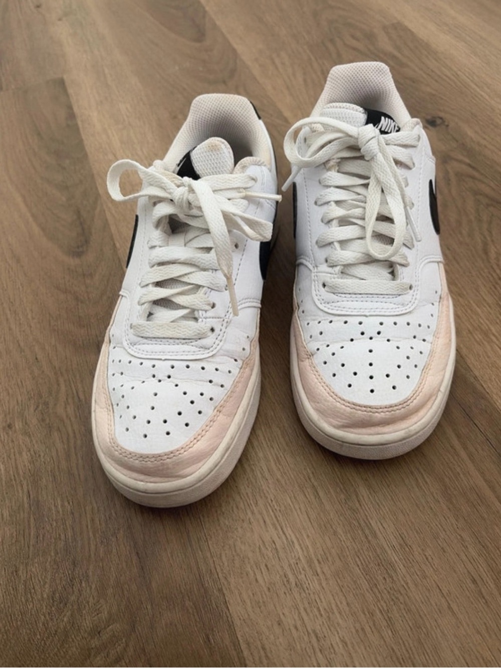 Nike Women’s White Sneakers with Pale Pink Toe Accent